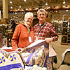 Peggy and Arlin at Cabela’s with the quilt that Peggy made and donated to the club as a fund raiser.